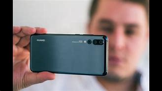 Image result for How Do You Put a Photo into Magazine Unlock Huawei P20 Pro Phone