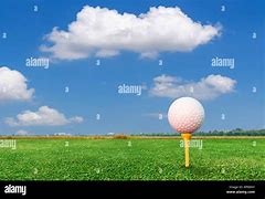 Image result for Golf Ball On Tee with Hill in Background