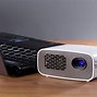 Image result for Mini Portable Projector Being Used