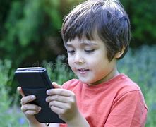 Image result for Kid Looking at Phone