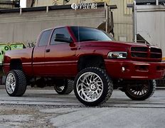 Image result for Jacked Up 2500 Ram Red
