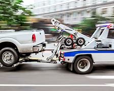 Image result for Tow Truck Towing a Car