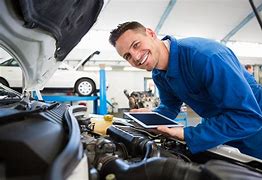 Image result for Mechanic Working On Car