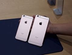 Image result for iPhone 6s Plus Size in Hand