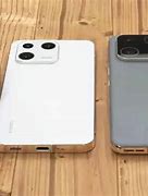 Image result for Comparayif iPhone 14 Et Xiaomi 13 Pro Photo