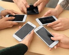 Image result for People On Phones at Table