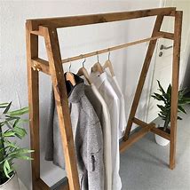 Image result for Wooden Coat Hangers via Take a Lot