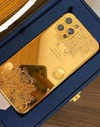Image result for iPhone 14 Pro Gold with Hot Pink Case
