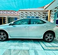 Image result for Toyota Corolla Beige 2010