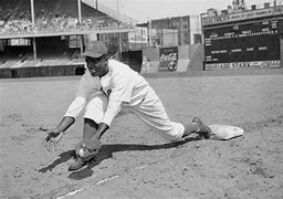 Image result for Jackie Robinson First Baseball