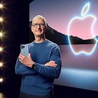 Image result for Tim Cook Holding iPhone