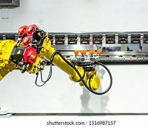 Image result for Robots Working in a Factory