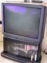 Image result for VCR Under CRT TV in TV Stand