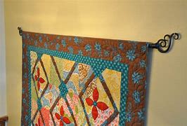 Image result for Pictures of Quilts Hanging From a Curtain Rod with Rings