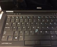Image result for Dell Laptop Blue Ring On Keyboard