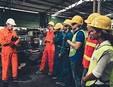 Image result for Workers Working in a Factory