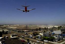 Image result for San Diego Airport Plane Flying Over the City