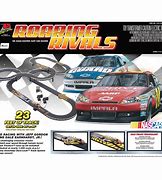 Image result for Hand Holding Toy NASCAR Race Car