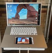 Image result for Cell Phone Inside a Laptop