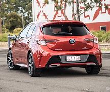 Image result for Toyota Corolla ZR Hybrid Volcanic Red