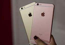 Image result for A Picture of a Black Person Holdig a iPhone 6 Plus Rose Gold