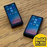 Image result for Child Holding iPhone 13 Mini