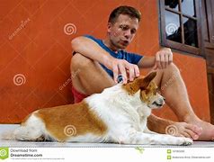 Image result for Guy Sitting Petting Dog
