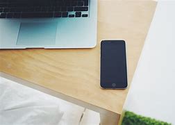 Image result for iPhone 12 Purple On Table Banner