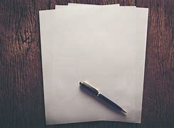 Image result for Image of a Blank Paper and a Pen to Tell a Story