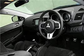 Image result for 1999 Mitsubishi Lancer Evolution Interior