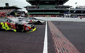 Image result for NASCAR Fan Holding Sign