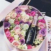 Image result for Flowers in an Andre Champagne Bottle