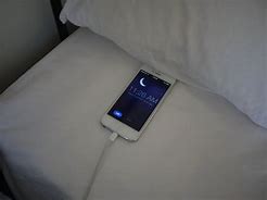 Image result for iPhone X in Bed