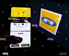 Image result for Hand Holding a Smartphone Displaying MTN Momo Ad