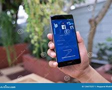 Image result for hands holding huawei phones