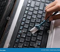 Image result for Cleaning a Laptop Stock-Photo