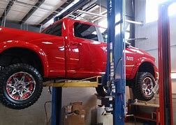 Image result for Red Ram 1500 Lifted