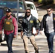 Image result for Picture of an FBI Guy Doing Something Cool