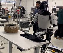 Image result for Images Musk Robot Folding Clothes