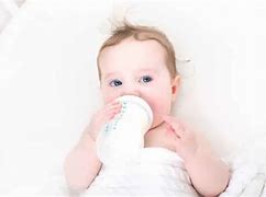 Image result for Baby Holding Bottle