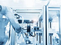 Image result for Robot Working in the Light Out Factory