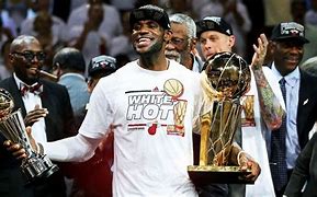 Image result for Miami Heat LeBron Holding Trophy