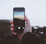Image result for Person Taking a Photo Using an iPhone