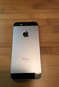 Image result for iPhone SE Space Gray Size in Hands