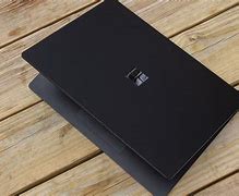 Image result for Microsoft Surface Laptop On a Table