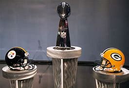Image result for Super Bowl Trophy with Facing Helmets
