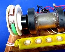 Image result for Magnetic Motor Charging a Battery