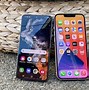 Image result for iPhone 13 Mini vs Galaxy S23 in a Hand