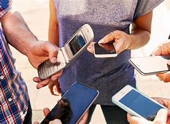 Image result for People Looking at Flip Phone