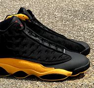 Image result for Air Jordan 13 Black and Yellow